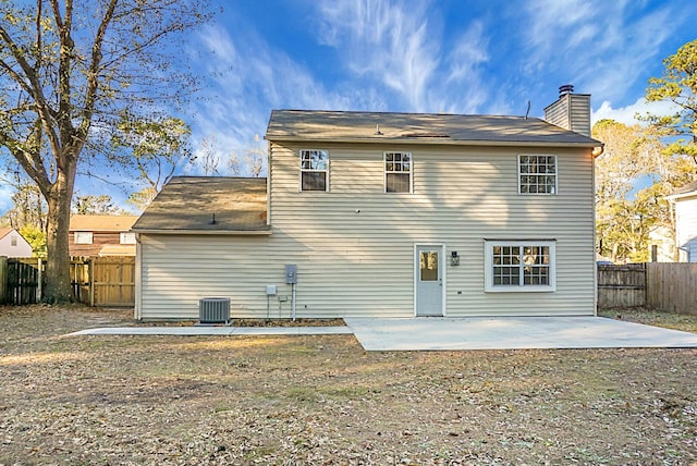 rear view of house featuring central AC and a patio