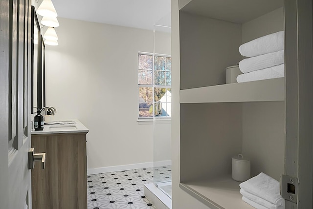 bathroom featuring vanity and a shower