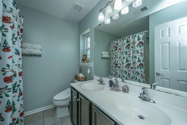 bathroom with visible vents, toilet, and a sink