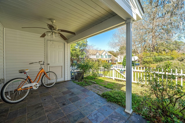 view of patio / terrace featuring a residential view, a ceiling fan, and fence