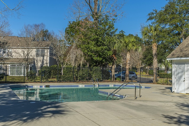 community pool featuring fence