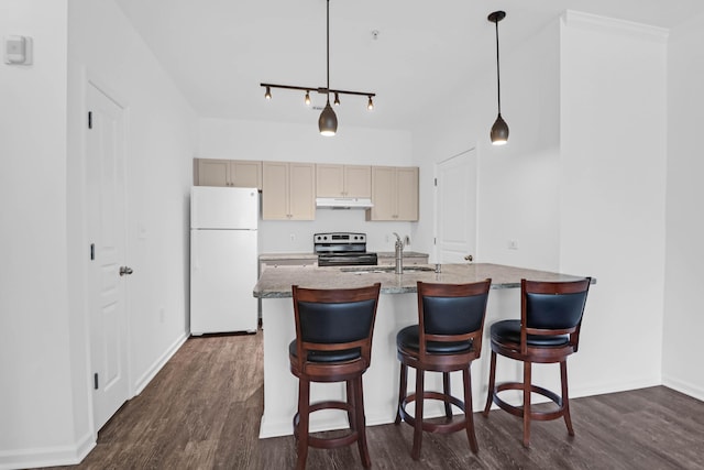 kitchen featuring white refrigerator, sink, electric range, and decorative light fixtures