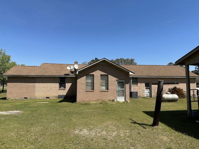 7819 Bells Hwy, Ruffin, SC 29475 - rear view of house featuring a lawn, brick siding, crawl space, and roof with shingles