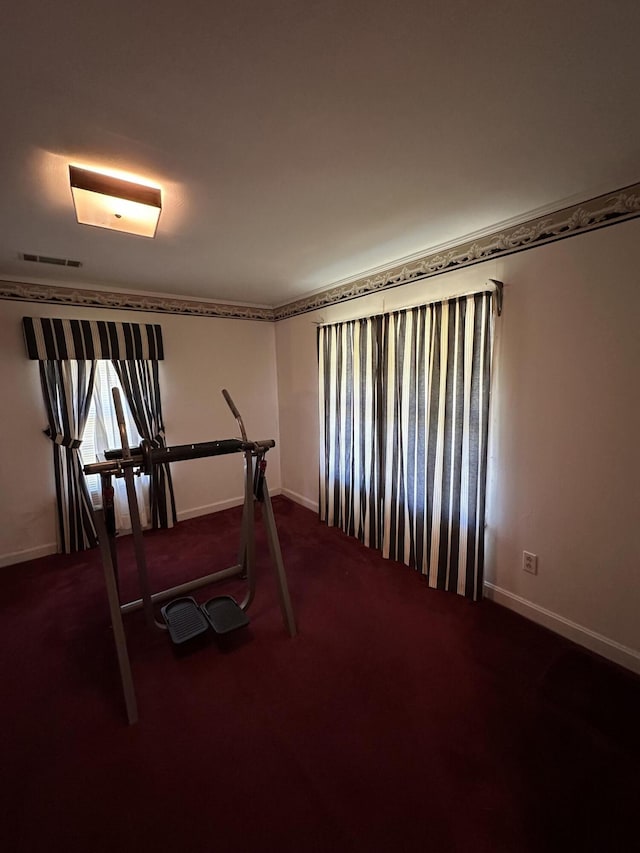 7819 Bells Hwy, Ruffin, SC 29475 - exercise area featuring baseboards, dark colored carpet, and visible vents