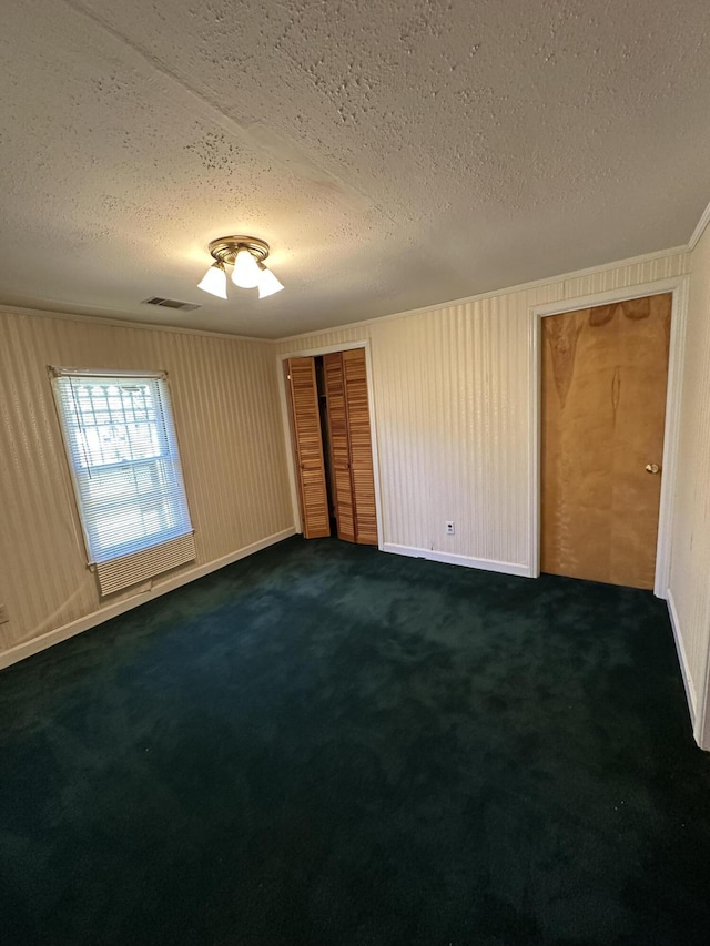 7819 Bells Hwy, Ruffin, SC 29475 - empty room featuring a textured ceiling, visible vents, and dark colored carpet