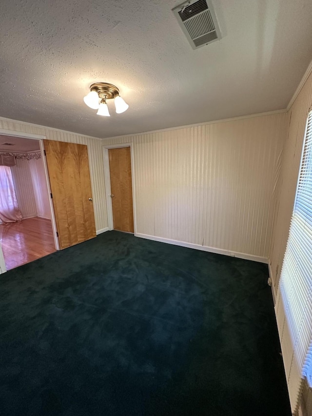 7819 Bells Hwy, Ruffin, SC 29475 - unfurnished room featuring a healthy amount of sunlight, visible vents, carpet, and a textured ceiling
