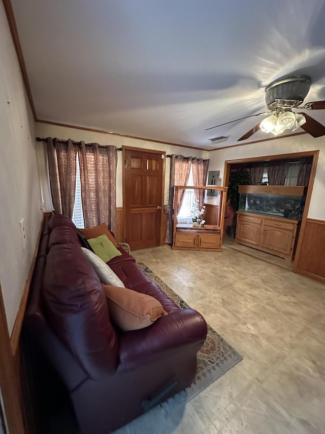 7819 Bells Hwy, Ruffin, SC 29475 - living area featuring a ceiling fan, visible vents, crown molding, and wainscoting