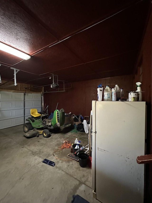 7819 Bells Hwy, Ruffin, SC 29475 - garage featuring a garage door opener and freestanding refrigerator