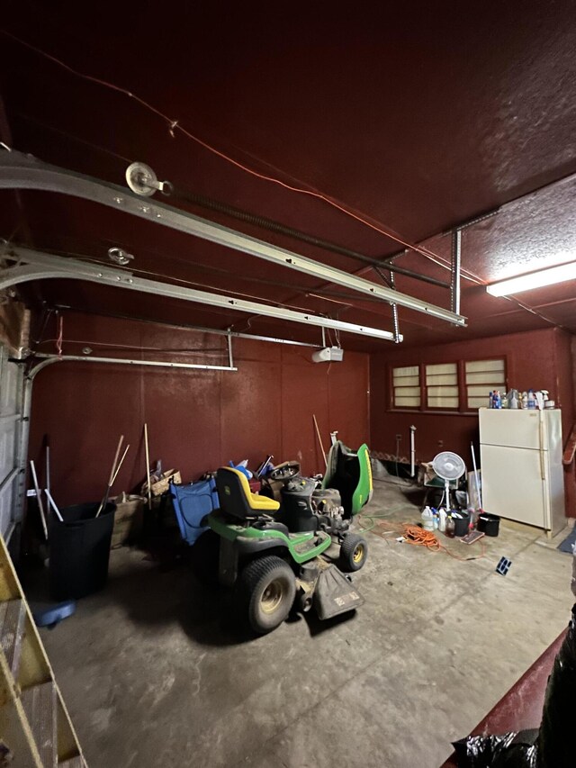 7819 Bells Hwy, Ruffin, SC 29475 - garage with a garage door opener and freestanding refrigerator
