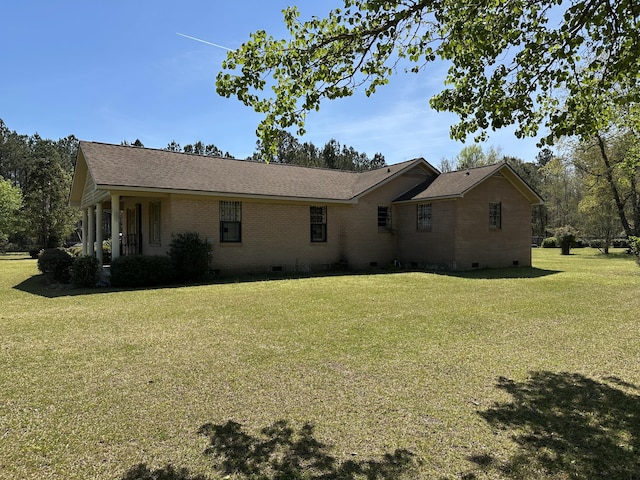 7819 Bells Hwy, Ruffin, SC 29475 - rear view of house featuring crawl space, a shingled roof, brick siding, and a lawn