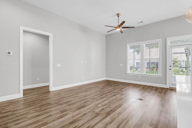 unfurnished room featuring ceiling fan and hardwood / wood-style floors