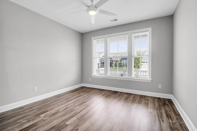 empty room featuring hardwood / wood-style floors and ceiling fan