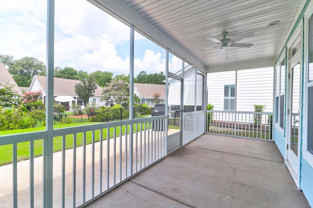 sunroom / solarium featuring ceiling fan and a wealth of natural light