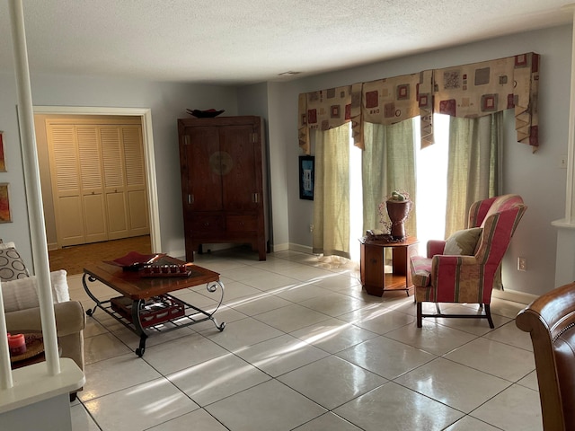 306 Park St, Saint George, SC 29477 - living room with light tile patterned flooring and a textured ceiling