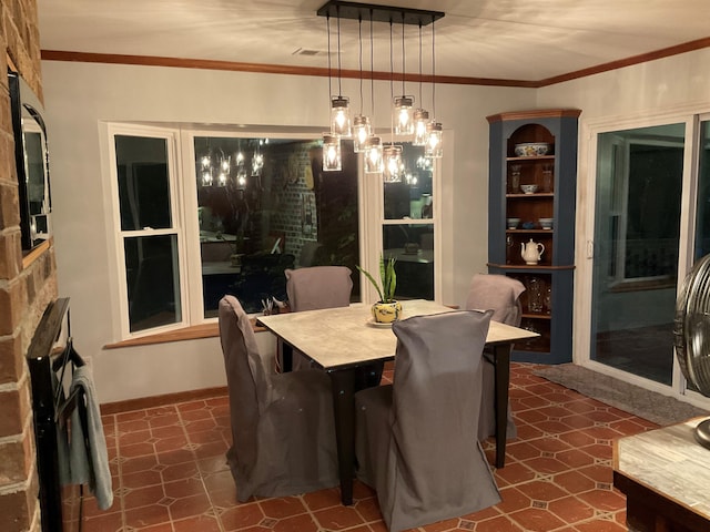 306 Park St, Saint George, SC 29477 - dining room featuring ornamental molding and dark flooring