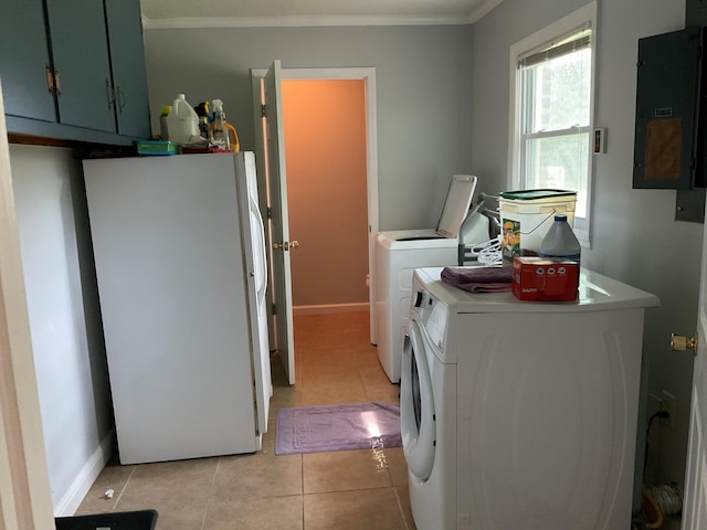 306 Park St, Saint George, SC 29477 - washroom with washer and clothes dryer, cabinet space, ornamental molding, light tile patterned floors, and electric panel