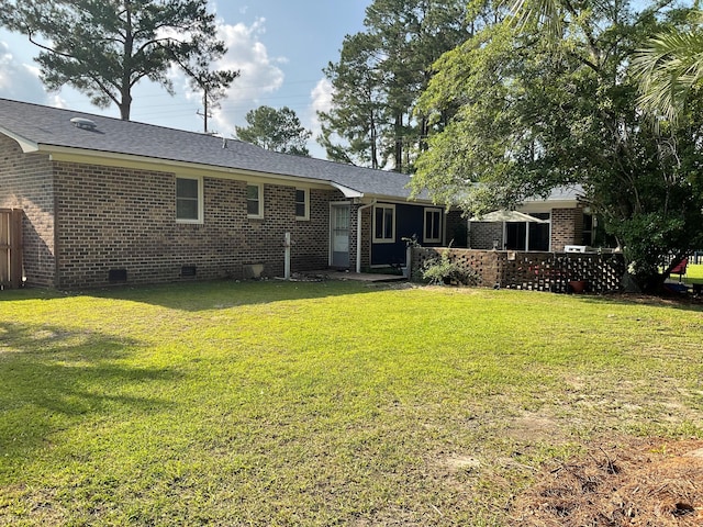 306 Park St, Saint George, SC 29477 - back of house with crawl space, brick siding, and a lawn