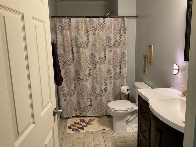 306 Park St, Saint George, SC 29477 - bathroom with vanity, ornamental molding, wood finished floors, and curtained shower