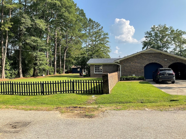 306 Park St, Saint George, SC 29477 - view of front of property with brick siding, concrete driveway, and a carport