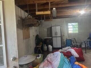 306 Park St, Saint George, SC 29477 - basement with freestanding refrigerator
