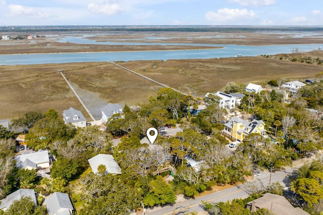 birds eye view of property with a water view and a residential view