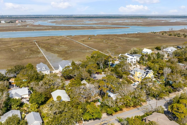 drone / aerial view featuring a water view and a residential view