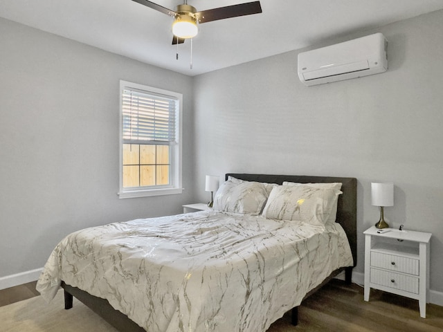 bedroom with ceiling fan, dark hardwood / wood-style floors, and a wall mounted AC