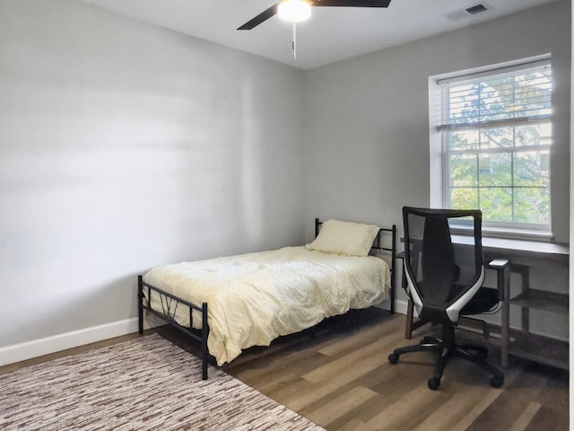 bedroom with hardwood / wood-style flooring and ceiling fan