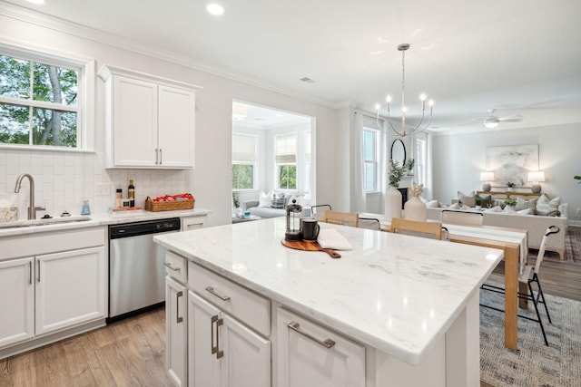 770 Opal Wing St, Moncks Corner, SC 29461 - kitchen featuring dishwasher, a sink, light wood-style flooring, backsplash, and ornamental molding