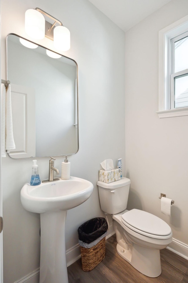 770 Opal Wing St, Moncks Corner, SC 29461 - half bathroom featuring toilet, wood finished floors, baseboards, and a sink
