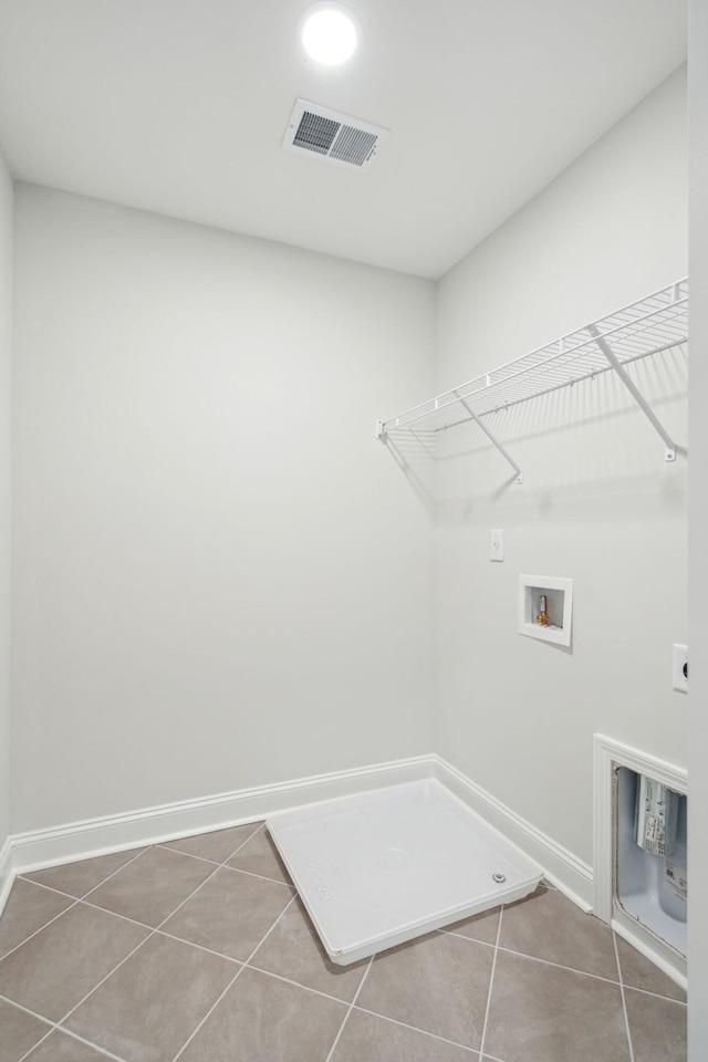 770 Opal Wing St, Moncks Corner, SC 29461 - laundry area with tile patterned flooring, washer hookup, electric dryer hookup, and baseboards