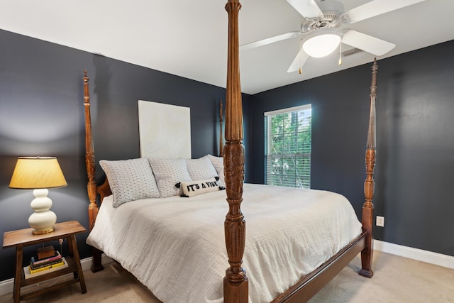 carpeted bedroom with baseboards, a ceiling fan, and visible vents