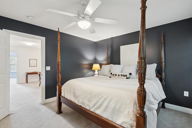 carpeted bedroom with baseboards and ceiling fan