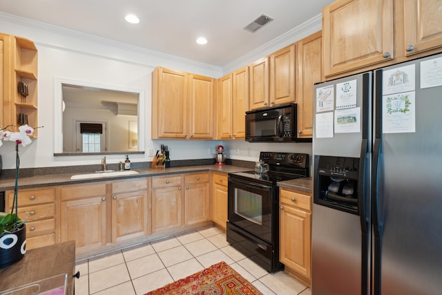 kitchen featuring black appliances, dark countertops, light tile patterned flooring, and a sink