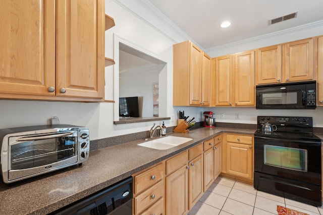 kitchen featuring a sink, dark countertops, a toaster, visible vents, and black appliances