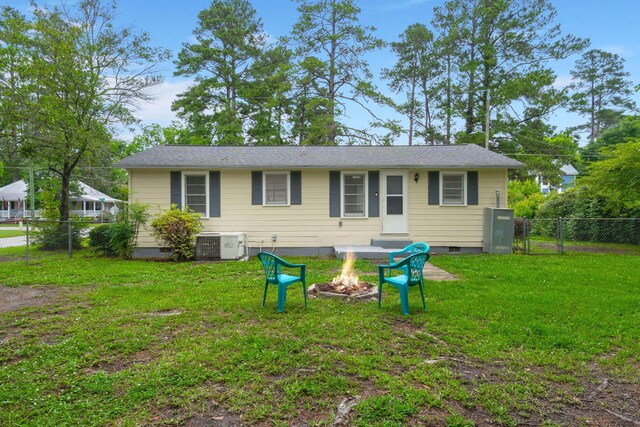 407 Raysor St, Saint George, SC 29477 - view of front of house featuring a fire pit, crawl space, central air condition unit, and a gate