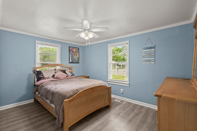 407 Raysor St, Saint George, SC 29477 - bedroom featuring baseboards, multiple windows, wood finished floors, ornamental molding, and ceiling fan