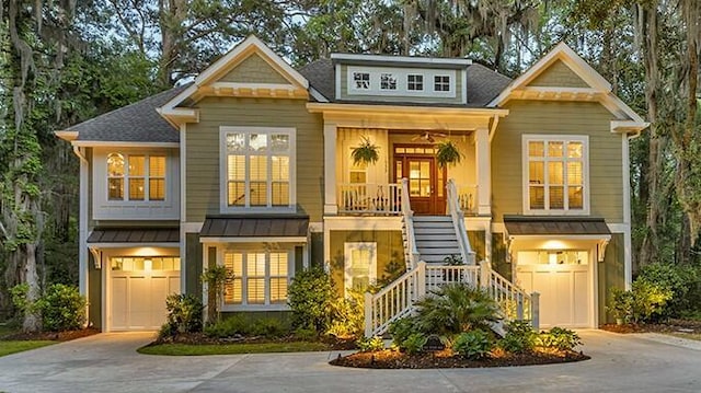 1033 Tuckers Rd, Pawleys Island, SC 29585 - view of front of property with stairs, an attached garage, and concrete driveway