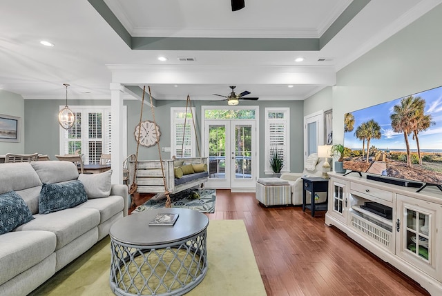 1033 Tuckers Rd, Pawleys Island, SC 29585 - living area with french doors, dark wood finished floors, ceiling fan with notable chandelier, and a healthy amount of sunlight