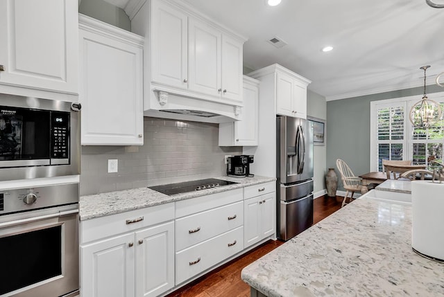 1033 Tuckers Rd, Pawleys Island, SC 29585 - kitchen with appliances with stainless steel finishes, recessed lighting, decorative backsplash, dark wood-type flooring, and visible vents