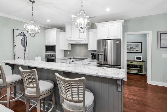 1033 Tuckers Rd, Pawleys Island, SC 29585 - kitchen featuring baseboards, white cabinets, a chandelier, backsplash, and stainless steel appliances