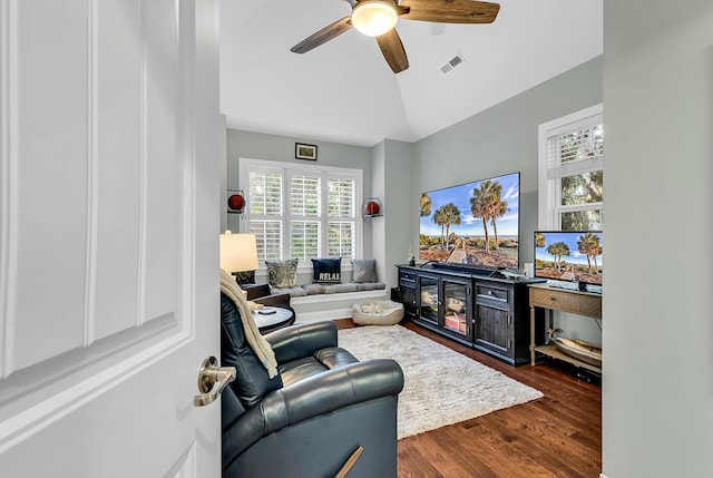 1033 Tuckers Rd, Pawleys Island, SC 29585 - living room featuring visible vents, dark wood-style flooring, ceiling fan, and vaulted ceiling