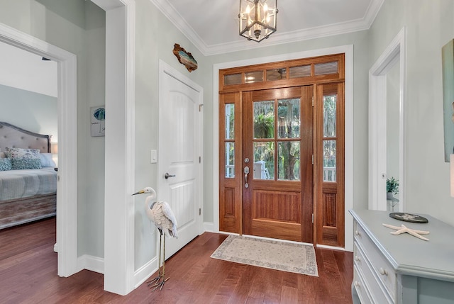1033 Tuckers Rd, Pawleys Island, SC 29585 - foyer entrance with baseboards, dark wood finished floors, ornamental molding, and an inviting chandelier