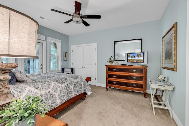 1033 Tuckers Rd, Pawleys Island, SC 29585 - carpeted bedroom with baseboards, visible vents, ceiling fan, and a closet
