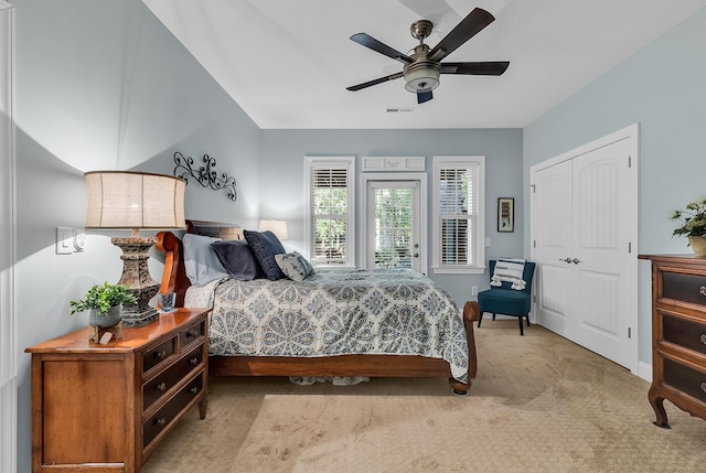 1033 Tuckers Rd, Pawleys Island, SC 29585 - bedroom with ceiling fan, access to exterior, light colored carpet, visible vents, and a closet