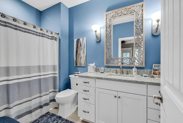 1033 Tuckers Rd, Pawleys Island, SC 29585 - bathroom featuring vanity, a ceiling fan, a shower with shower curtain, and toilet