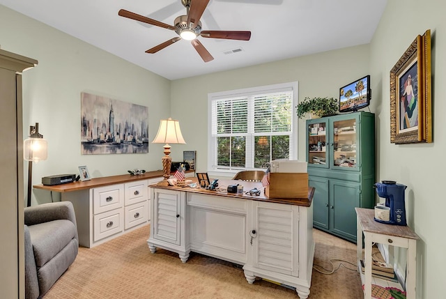 1033 Tuckers Rd, Pawleys Island, SC 29585 - home office featuring built in study area, a ceiling fan, light colored carpet, and visible vents