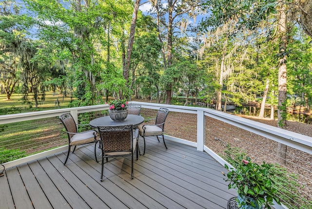 1033 Tuckers Rd, Pawleys Island, SC 29585 - wooden deck with outdoor dining area