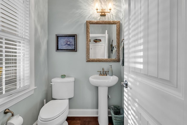1033 Tuckers Rd, Pawleys Island, SC 29585 - bathroom featuring baseboards, a sink, and toilet
