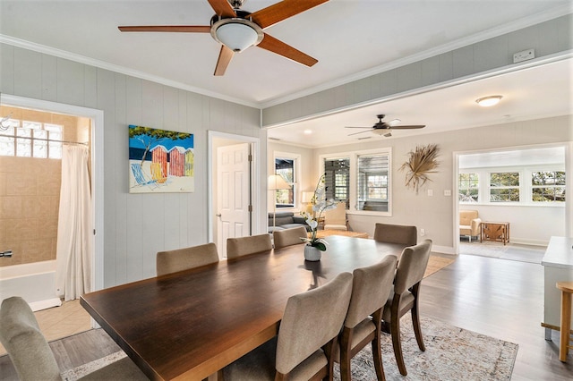 504 W Ashley Ave, Folly Beach, SC 29439 - dining space featuring healthy amount of natural light, a ceiling fan, ornamental molding, and light wood finished floors